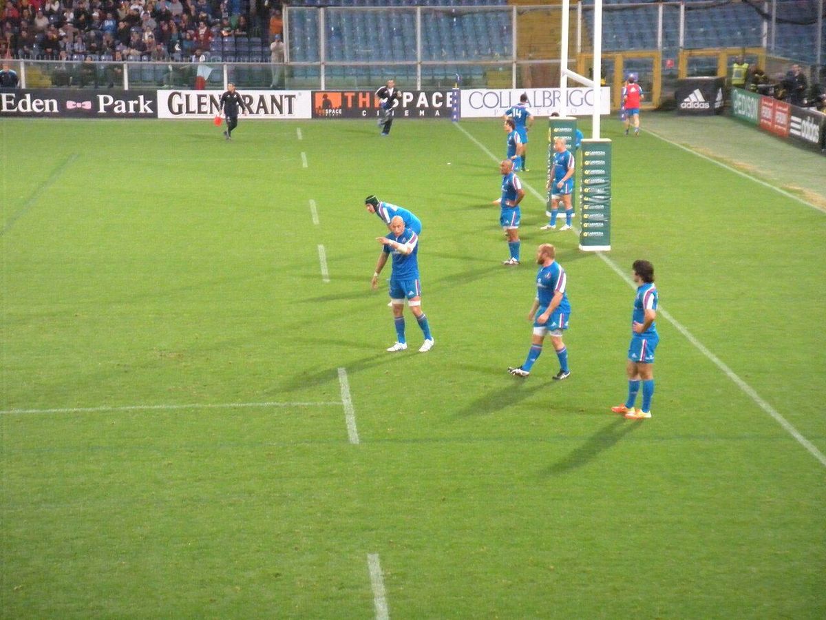 Rugby forwards packing down together in a scrum